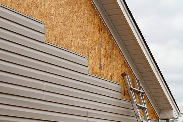 Professional Emergency Siding Repair technician working in Larimer, PA